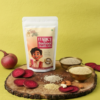 The Pickle Story Millet Beetroot Health Mix retail pouch with raw ingredients including fresh beetroot slices, almonds, cashews, and assorted millets on a rustic wooden platter.